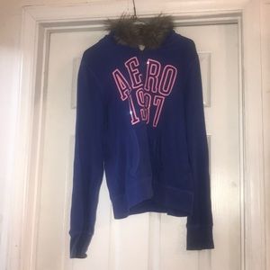 Blue zip up coat with fake fur and pink detailing
